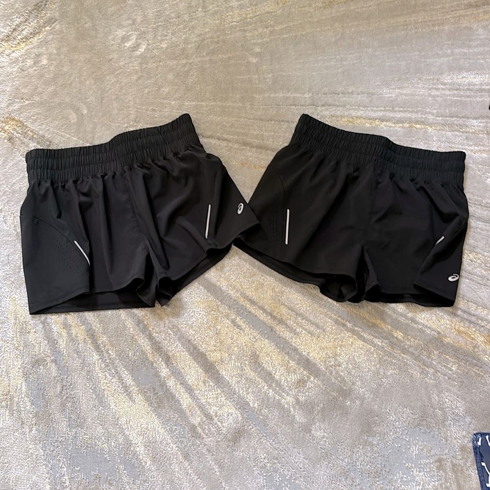 2 pairs of black Asics 2 in 1 Shorts, brand new condition.